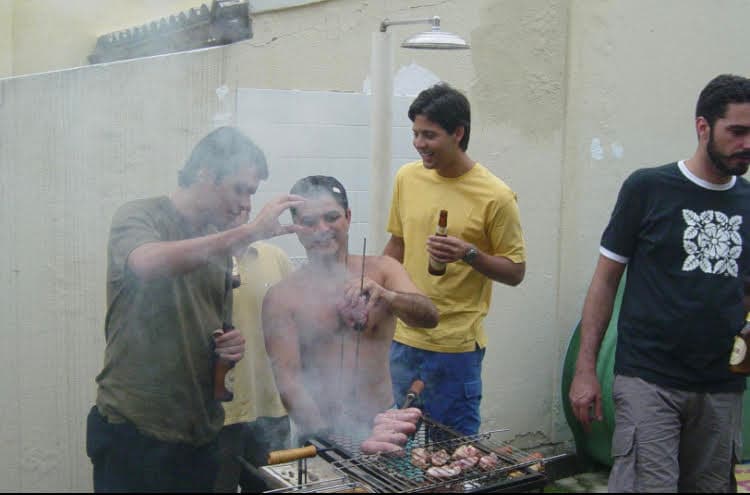 Smoke rising at a classic Brazilian backyard BBQ